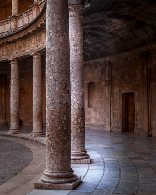 Columns at the Palace of Charles V at Granada in southern Spain, inside the Alhambra, a former Nasrid palace complex on top of the Sabika hill.